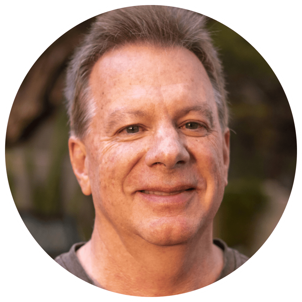 Smiling man in a circle frame.