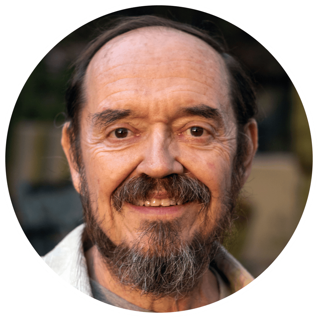 Portrait of an older man with a beard and mustache.