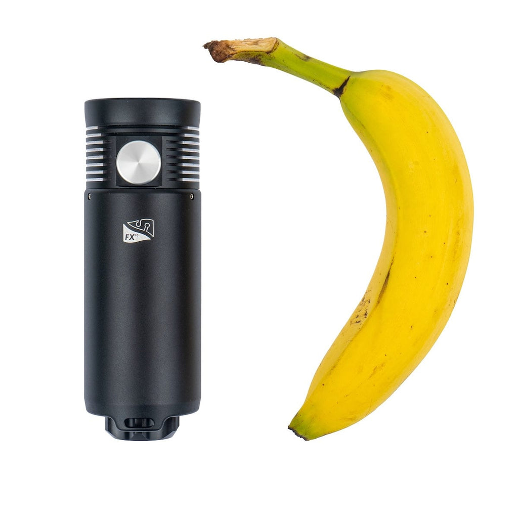 FX40 flashlight next to banana for scale