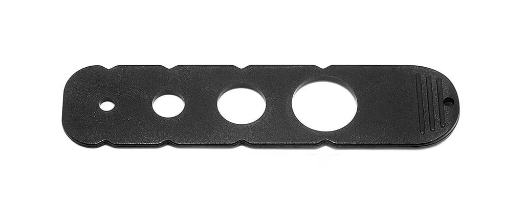 Black circular card with multiple holes.