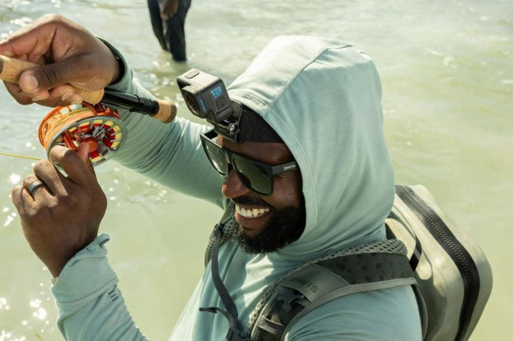 Man fishing with head strap camera