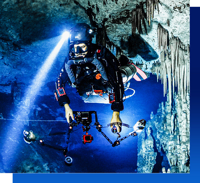 Scuba diver explores underwater cave, Paragon Dive Rentals